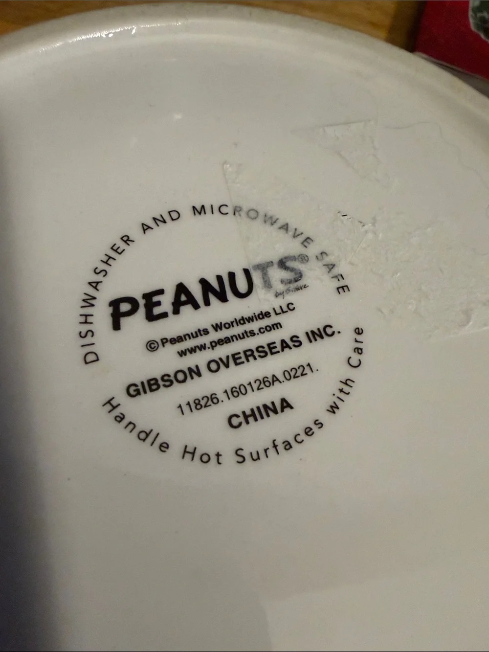 Gibson White Ceramic Peanuts 'MORE PLEASE!' Dog Bowl with Red Bowl Graphic